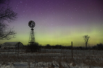 northern lights behind old windmill