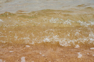 Sea water on the sandy shore.