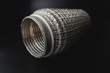 Selective focus picture with noise effect of exhaust pipe flexible connector.
