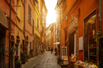 Yellow and red bright houses on narrow traditional streets of an Italian town.