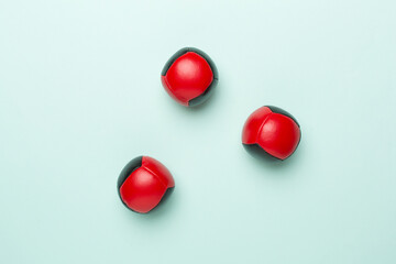 Colorful juggling ball on color background, top view