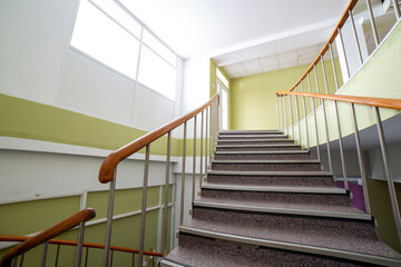 A fragment of the interior with a staircase to the second floor in a residential building