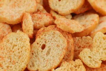 Bread croutons snacks with spices close-up.