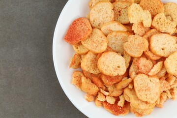 Bread croutons snacks in a plate.