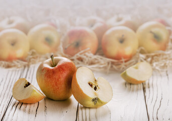 Fresh red yellow apples on a wooden table. On a wooden background.