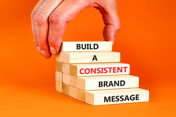 Consistent brand message symbol. Concept words build a consistent brand message on wooden blocks....