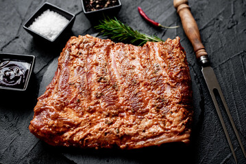marinated raw pork ribs on stone background
