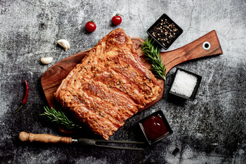 marinated raw pork ribs on stone background