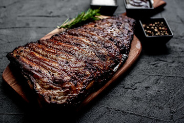 pork ribs on a grill on a stone background 