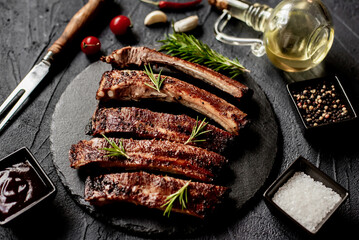 pork ribs on a grill on a stone background 