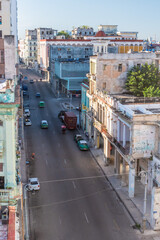 Old American car in Havana Cuba with old buildings