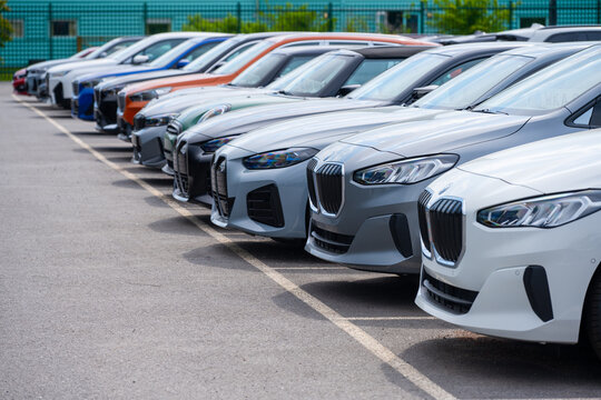 M?lndal, Sweden - May 14 2023: Brand new Mini and BMW cars in a parking lot.