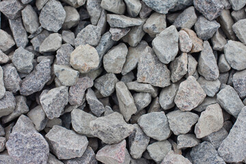 Gray building stones of medium size.