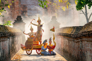 Asian man and woman with Thai old traditional dress stay together on traditional chariot in front...