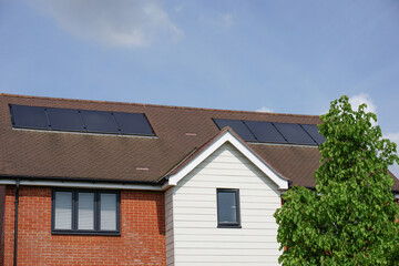 residential property rooftop with solar cell panels. 