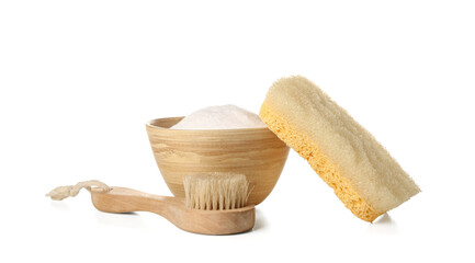Bowl of baking soda, cleaning brush and sponge on white background