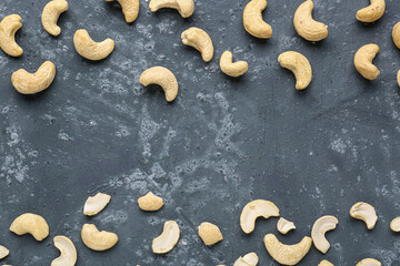 Frame made of tasty cashew nuts on blue background