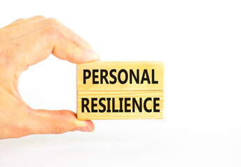 Personal resilience symbol. Concept word Personal resilience on wooden blocks. Beautiful white table white background. Businessman hand. Business psychological personal resilience concept. Copy space.
