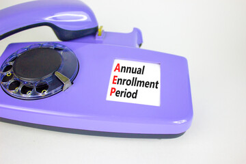AEP symbol. Concept words AEP Annual enrollment period on beautiful old disk phone. Beautiful white...