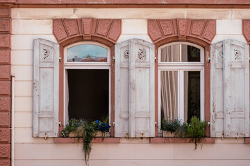 Fototapeta na wymiar old wooden shutters in a city