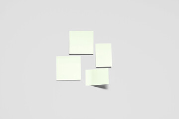 Pale yellow sticky notes on grey background