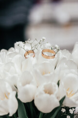 wedding rings on a bouquet