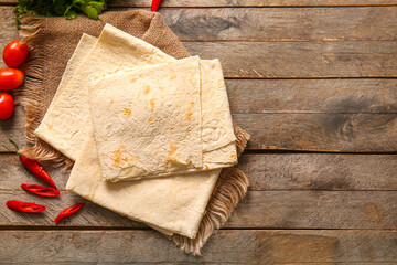 Fresh lavash on wooden background