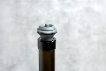 wine opener accessories tools,rose bottle and brie camembert cheese isolated gray tiles...