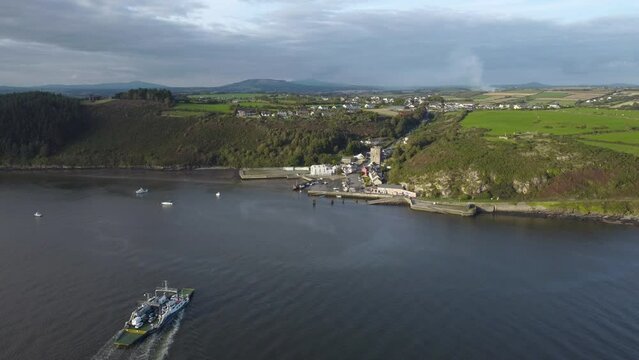 Drone River Suir, Ireland - Aerial view of The Passage East Ferry across River Suir linking the villages of Passage East in Co. Waterford and Ballyhack in Co. Wexford