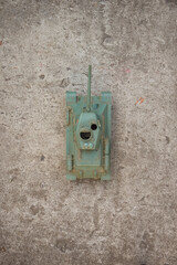 Scale model tank on a concrete background. Toy. Background. 