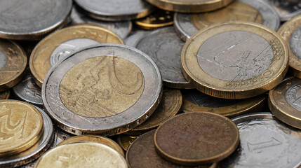 A pile of gold and silver coins.