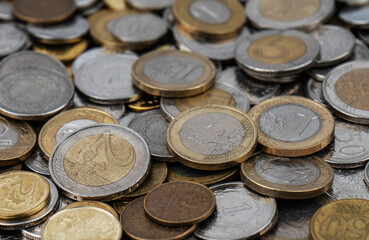A pile of gold and silver coins.