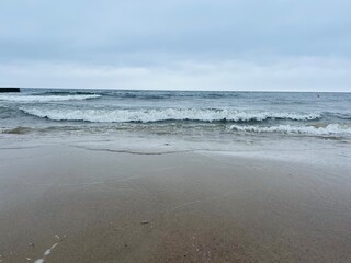Cloudy gray seascape, sea coast, windy cloudy weather 