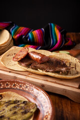 Taco campechano style, Carne Asada. (roast meat) and chorizo or longaniza, very popular dish in northern Mexico, also called Asado, Discada or Parrillada.