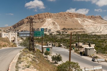 Crossroads and road signs in front of Maaloula village. Syria.