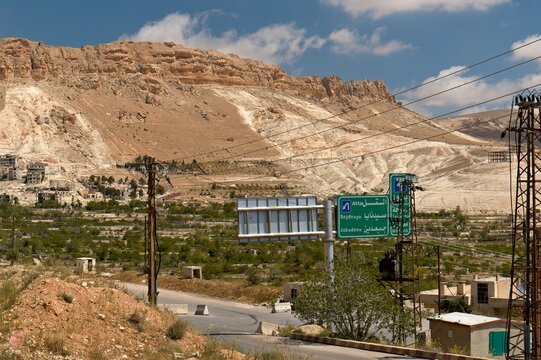 Crossroads and road signs in front of Maaloula village. Syria.