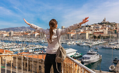 Naklejka premium Tourist woman in french city Marseille. Marina and sea, France, Europe