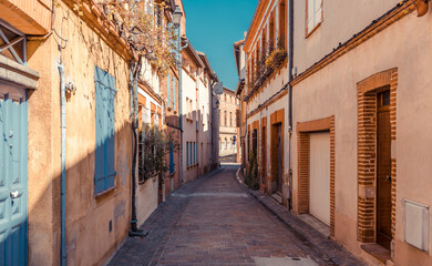 Fototapeta na wymiar Street in old Toulouse town, Occitanie region, France, South Europe.