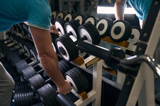 Male athlete preparing for strength workout at gym