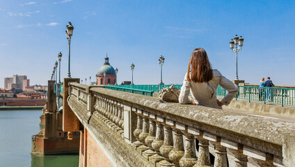 Tourist woman in Toulouse city and Garonne river in France, Europe