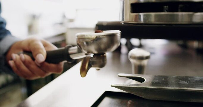 Hands, barista and coffee machine with a woman waitress at work in a cafe for service closeup. Kitchen, small business and preparation with a female person working in a diner, bistro or cafeteria
