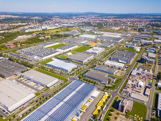 Fototapeta na wymiar Aerial view of industrial zone and technology park on Bory suburb of Pilsen city in Czech Republic, Europe. Industrial fields from above. Background concept.
