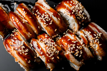 Top view of Japanese traditional sushi roll with salmon, smoked eel, philadelphia cheese