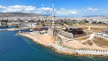 Fototapeten Verlassene Gebäude Aerial drone view from abandoned public fertiliser factory as seen at sunny winter slightly cloudy morning, Piraeus main port, Attica, Greece  © aerial-drone