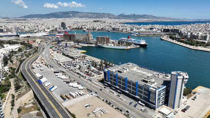 Obraz premium Aerial drone photo from busy port of Piraeus where passenger ships travel to Aegean destination islands, Attica, Greece