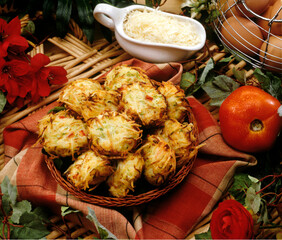 Broccoli vegetables cakes dish on rustic farm background.