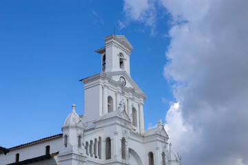 Fototapeta na wymiar White Christian church in Colombia, a Latin American country, the church has a colonial style.