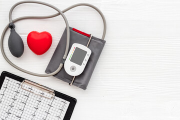 Blood pressure monitor or tonometer on doctor cardiologist table desk
