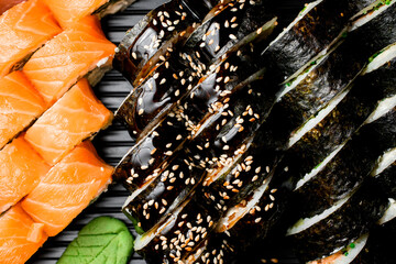 Closeup vief of appetizing asian sushi set of rolls maki and Philadelphia