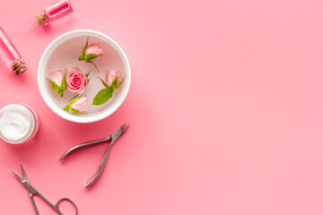 Hands and nail care spa set with pink roses flowers. Beauty care salon spa.